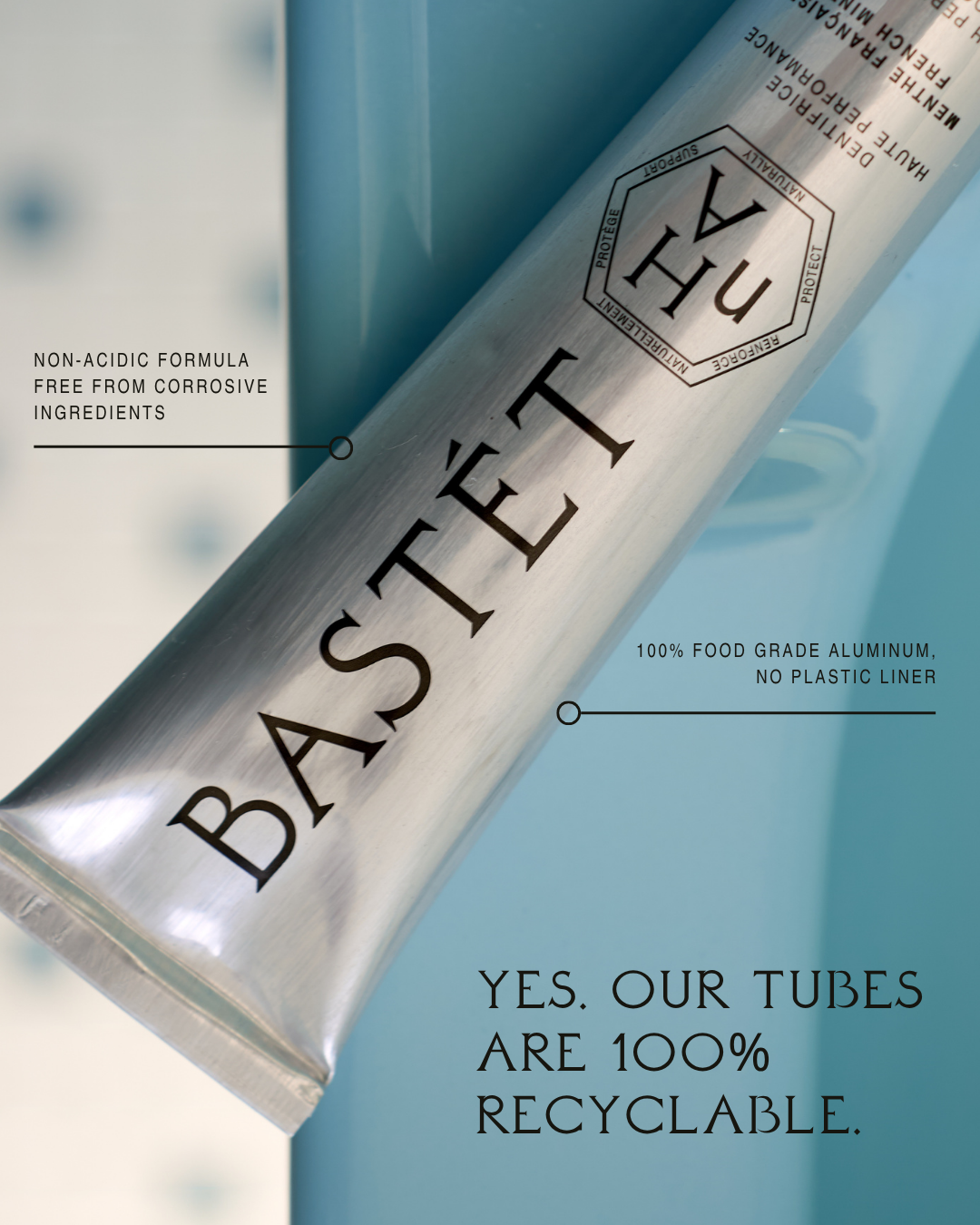 Bastét aluminium toothpaste tube against a blue sink, 100% recyclable